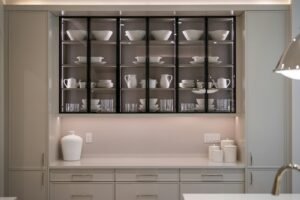 Organized kitchen cabinet showcasing kitchen organization hacks with neatly arranged dishware